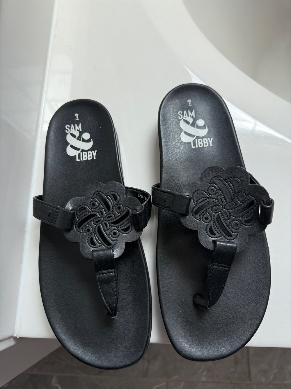 Sam & Libby Black Floral Cutout Toe-Thong Sandals - Picture 2 of 3